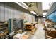 Well-lit workshop with storage shelves and equipped with a ceiling-mounted heater at 3660 S Conservation Club Rd, Morgantown, IN 46160