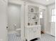 Bathroom featuring toilet, built-in storage and patterned tile floor at 3744 S Meridian St, Indianapolis, IN 46217
