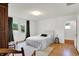 Bedroom with neutral rug, wooden floors, good light and a comfortable bed at 3744 S Meridian St, Indianapolis, IN 46217