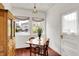 Charming breakfast nook with cozy seating area, natural light, and vintage-style cabinets at 3744 S Meridian St, Indianapolis, IN 46217