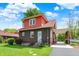 Brick home featuring a portico and landscaped front yard at 3744 S Meridian St, Indianapolis, IN 46217
