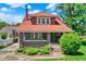 Charming two-story home with a brick facade, covered front porch, and well-manicured landscaping at 3744 S Meridian St, Indianapolis, IN 46217