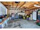 Unfinished garage interior with pegboard and shelving; ideal space for tools and projects at 3744 S Meridian St, Indianapolis, IN 46217