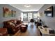 Cozy living room featuring a leather sofa, home office setup and modern decor at 3744 S Meridian St, Indianapolis, IN 46217