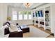 Cozy living room with a comfortable couch, built-in bookshelves, and lots of natural light at 3744 S Meridian St, Indianapolis, IN 46217