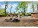 Large backyard with scattered furniture, a shed, and an above-ground swimming pool at 3975 Denwood Dr, Indianapolis, IN 46226