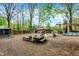 Large backyard with scattered furniture, a shed, and an above-ground swimming pool at 3975 Denwood Dr, Indianapolis, IN 46226