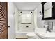 Bathroom featuring a tub/shower combo, with a white vanity and tile at 3975 Denwood Dr, Indianapolis, IN 46226