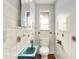 Bathroom featuring white tiles, a teal sink, with a unique design at 3975 Denwood Dr, Indianapolis, IN 46226