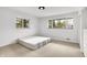 Bedroom with two windows allowing in natural light and plush carpeting at 3975 Denwood Dr, Indianapolis, IN 46226