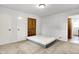 A minimalist bedroom with a comfortable mattress, a closet, and neutral carpeting at 3975 Denwood Dr, Indianapolis, IN 46226
