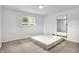 Bedroom featuring a window offering natural light and an accent mirror at 3975 Denwood Dr, Indianapolis, IN 46226