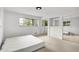 Bedroom featuring large windows and closet storage with plush neutral carpeting at 3975 Denwood Dr, Indianapolis, IN 46226
