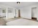 Bedroom featuring large closet and built-in dresser with plush neutral carpeting at 3975 Denwood Dr, Indianapolis, IN 46226