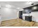 Charming kitchen featuring stainless steel appliances and dark cabinetry with laminate flooring at 3975 Denwood Dr, Indianapolis, IN 46226