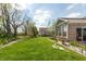 Spacious backyard with a well-maintained lawn, mature trees, and garden beds enhancing the landscape at 4281 Cairo Way, Avon, IN 46123