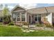 Backyard features a brick home with a patio, garden beds, and a well-maintained grassy area at 4281 Cairo Way, Avon, IN 46123