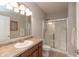 Neutral bathroom featuring a sink, vanity, toilet, and shower with sliding glass doors at 4281 Cairo Way, Avon, IN 46123