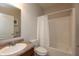 Neutral bathroom featuring a sink, vanity, toilet, and shower with a shower curtain at 4281 Cairo Way, Avon, IN 46123
