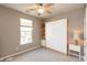 Bedroom with a ceiling fan, window, carpet and a Murphy bed that is closed at 4281 Cairo Way, Avon, IN 46123