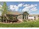 Brick home exterior with meticulously maintained lawn, multiple windows, and well manicured landscaping at 4281 Cairo Way, Avon, IN 46123