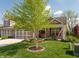 Charming two-story home with a manicured front yard, mature trees, and an attached garage at 4281 Cairo Way, Avon, IN 46123