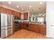 Well-equipped kitchen with stainless steel appliances, wooden cabinetry, and ample counter space at 4281 Cairo Way, Avon, IN 46123
