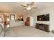 Spacious living room with a ceiling fan, modern furniture, and an open layout to the kitchen at 4281 Cairo Way, Avon, IN 46123