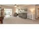 Living room featuring plush carpeting, recessed lighting, and sliding glass doors to a sunroom at 4281 Cairo Way, Avon, IN 46123