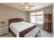 Cozy bedroom featuring a queen-sized bed, bedside tables, and large window with natural light at 4281 Cairo Way, Avon, IN 46123