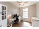 Bright office space with a large window, desk, and ample storage, perfect for working from home at 4281 Cairo Way, Avon, IN 46123