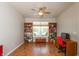 Office with a window, ceiling fan, and built-in shelving units full of items at 4281 Cairo Way, Avon, IN 46123