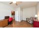 Office with a ceiling fan, wood floors, desk and chair set plus an armchair at 4281 Cairo Way, Avon, IN 46123