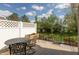Inviting patio area with a table and chairs, surrounded by greenery, creating a serene outdoor space at 4281 Cairo Way, Avon, IN 46123