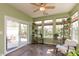 Inviting sunroom with ample natural light, tile flooring, and outdoor access to a patio space at 4281 Cairo Way, Avon, IN 46123