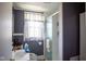 Bathroom featuring a shower over tub with sliding glass door and gray walls at 4429 Iowa St, Clayton, IN 46118
