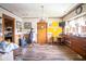 Bright dining room with hardwood floors, classic chandelier, and natural light, perfect for Gathering gatherings at 4429 Iowa St, Clayton, IN 46118