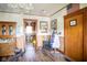 Inviting entryway featuring wood accents, decorative lighting, and hardwood floors at 4429 Iowa St, Clayton, IN 46118