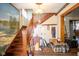 Foyer featuring a wooden staircase and decorative details at 4429 Iowa St, Clayton, IN 46118