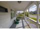 Charming front porch with seating, classic railing, and ample natural light, perfect for relaxing outdoors at 4429 Iowa St, Clayton, IN 46118