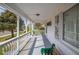 Inviting front porch featuring classic white railing, shade and space for seating, offering a relaxing outdoor area at 4429 Iowa St, Clayton, IN 46118