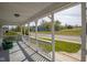 Covered front porch with charming railing and a pleasant view of the neighborhood, ideal for enjoying the outdoors at 4429 Iowa St, Clayton, IN 46118