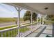 Relaxing front porch with white railing and comfortable flooring, offering an ideal spot to enjoy the neighborhood views at 4429 Iowa St, Clayton, IN 46118