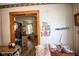 Open living room area with hardwood floors and an doorway into another room at 4429 Iowa St, Clayton, IN 46118