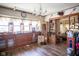 Spacious living room with hardwood floors, chandelier, large windows, and natural light at 4429 Iowa St, Clayton, IN 46118