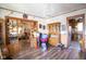 Spacious living room with hardwood floors, chandelier, and an open layout at 4429 Iowa St, Clayton, IN 46118