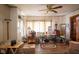 Bright living room with hardwood floors, neutral walls, and large windows, creating a comfortable living space at 4429 Iowa St, Clayton, IN 46118