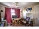 Cozy office space with wood desk, rocking chair, vintage Zenith sign, and floral wallpaper at 4429 Iowa St, Clayton, IN 46118