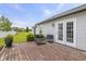Inviting backyard with wooden deck, black furniture and lush green lawn at 4615 Copper Grove Dr, Indianapolis, IN 46237
