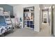 Shared bedroom with a bunk bed, tidy closet, and a view to the adjacent bathroom at 4615 Copper Grove Dr, Indianapolis, IN 46237